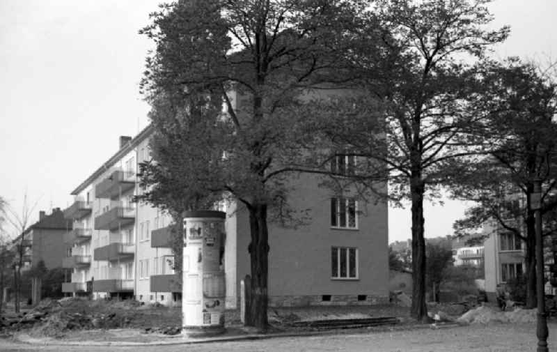 New buildings on the corner of Comeniusstrasse and Mueller-Berset-Strasse in the Striesen district in Dresden in the state Saxony on the territory of the former GDR, German Democratic Republic. Advertising pillar stands by the road