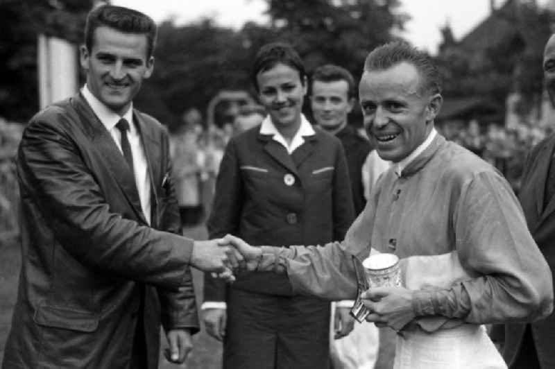 Ski jumper Helmut Recknagel ( left ) congratulates jockey Egon Czaplewski after the win in Dresden in the state Saxony on the territory of the former GDR, German Democratic Republic
