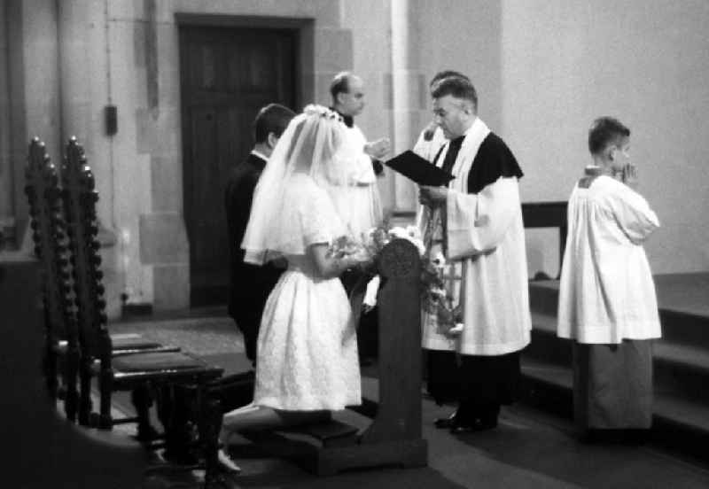 Bridal couple at the church wedding ceremony in Dresden in the state Saxony on the territory of the former GDR, German Democratic Republic