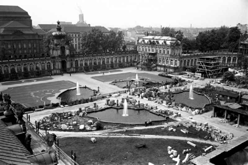 Construction site for the reconstruction of the war-damaged ruins of the Dresden Zwinger on Theaterplatz - Sophienstrasse in the Altstadt district of Dresden in the state of Saxony on the territory of the former GDR, German Democratic Republic