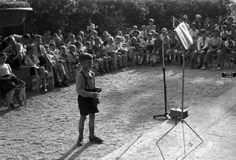 Fun and games for children and young people with pioneer clothing singing songs and making music in front of the Pioneer Palace of Albrechtsberg Castle in the district of Loschwitz in Dresden in the state of Saxony on the territory of the former GDR, German Democratic Republic