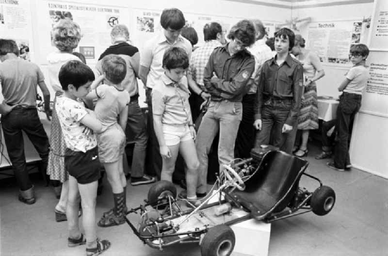 On Children's Day, young people from the Technology Working Group present their self-built car at the Pioneer Palace in Dresden, Saxony in the territory of the former GDR, German Democratic Republic