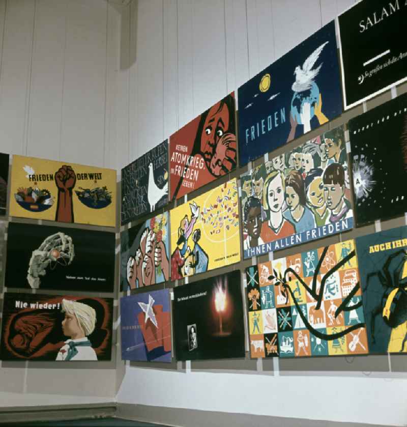 Posters protesting against the war and the nuclear threat at the IV. Art Exhibition in Dresden, Saxony in the area of the former GDR, German Democratic Republic