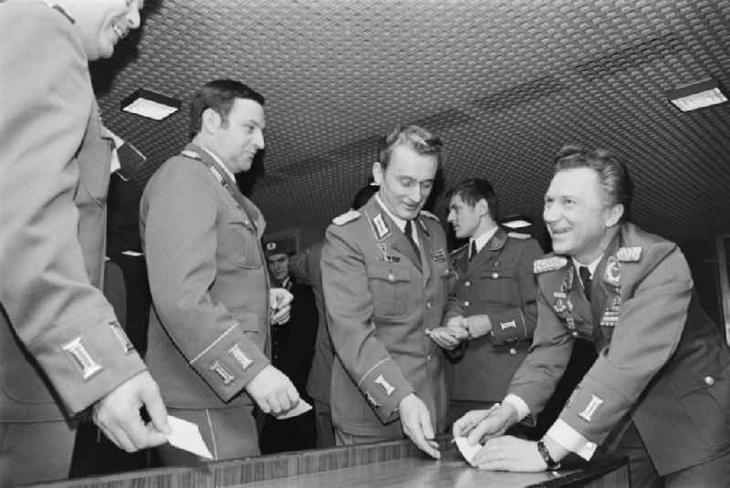 Aviation cosmonaut Colonel Siegmund Jaehn at an autograph session in front of soldiers, non-commissioned officers, officers and generals as members of the NVA National People's Army at the delegates' conference in the Kulturpalast in the Altstadt district of Dresden, Saxony in the territory of the former GDR, German Democratic Republic
