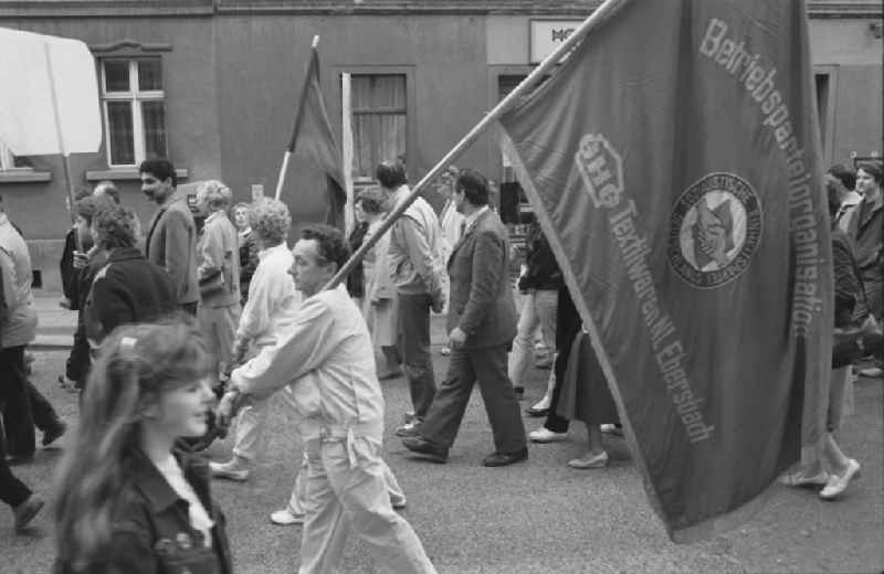 Participants of the May Day event with flags in Ebersbach in GDR