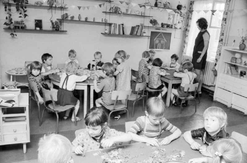 Playing children in the day care center of VEB mill Finow Eberswalde in Brandenburg on the territory of the former GDR, German Democratic Republic
