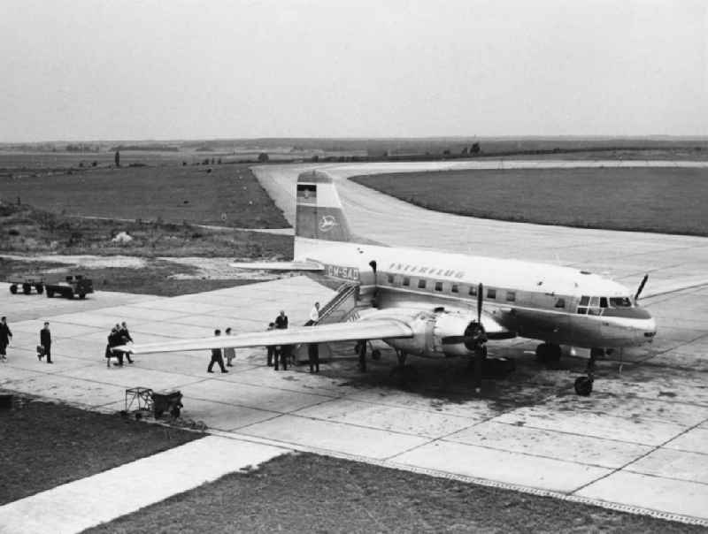 assenger handling on the tarmac at the airport Bindesleben on a commercial aircraft Ilyushin IL-14 P of the GDR airline INTERFLUG in Erfurt in Thuringia