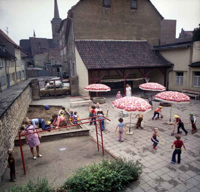 Children playing in the courtyard of a kindergarten in Erfurt, Thuringia in the territory of the former GDR, German Democratic Republic