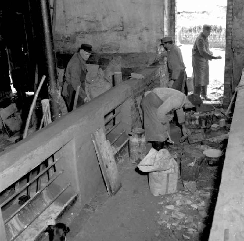 Agricultural work in a farm and farm during repair work in the barn on street Dorfstrasse in Fienstedt in the state Saxony-Anhalt on the territory of the former GDR, German Democratic Republic