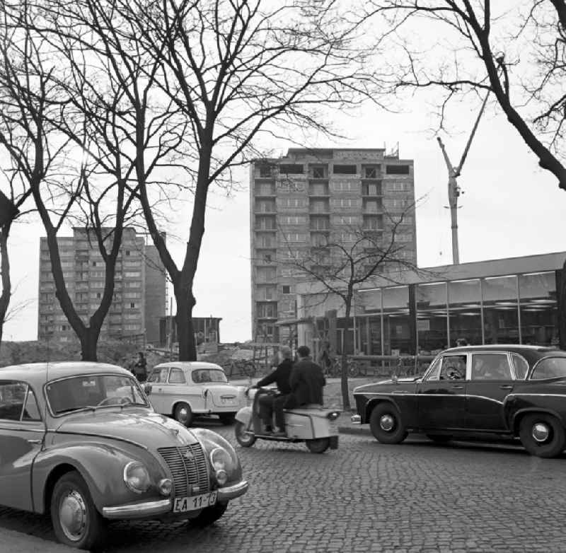 Car on the cobbled Leipziger Strasse in front of a supermarket in a new building area in Frankfurt (Oder) in the state Brandenburg on the territory of the former GDR, German Democratic Republic
