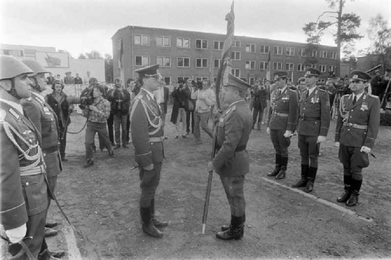 Return of the troop flag before the parade formation and march of soldiers and officers of Panzer Regiment 8 (PR-8) on the occasion of the ceremonial and media-effective dissolution of the troop unit on the grounds of the Artur-Becker barracks in Goldberg in the state of Mecklenburg-Western Pomerania on the territory of the former GDR, German Democratic Republic