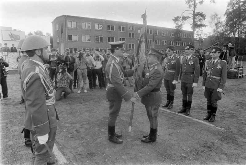 Return of the troop flag before the parade formation and march of soldiers and officers of Panzer Regiment 8 (PR-8) on the occasion of the ceremonial and media-effective dissolution of the troop unit on the grounds of the Artur-Becker barracks in Goldberg in the state of Mecklenburg-Western Pomerania on the territory of the former GDR, German Democratic Republic