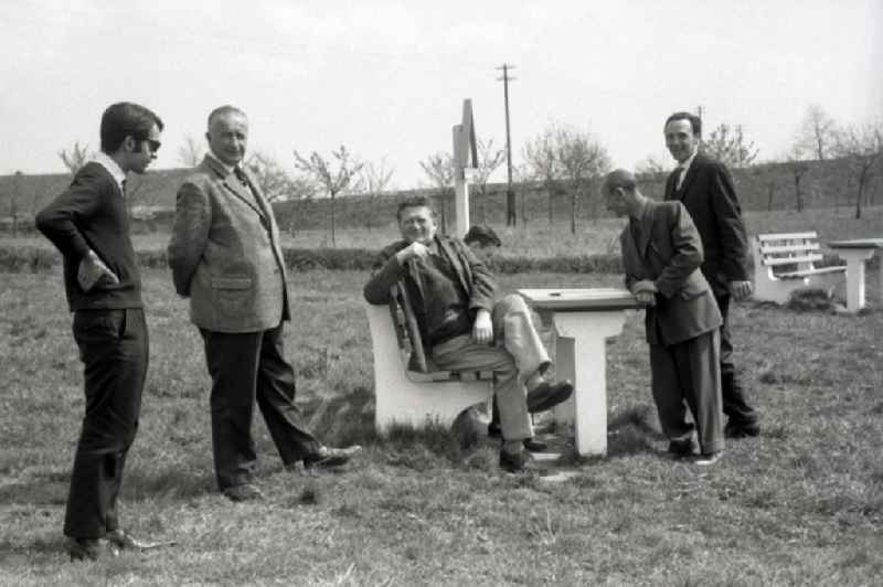 Men sitting together during a break at a motorway service area near Gotha in the state Thuringia on the territory of the former GDR, German Democratic Republic
