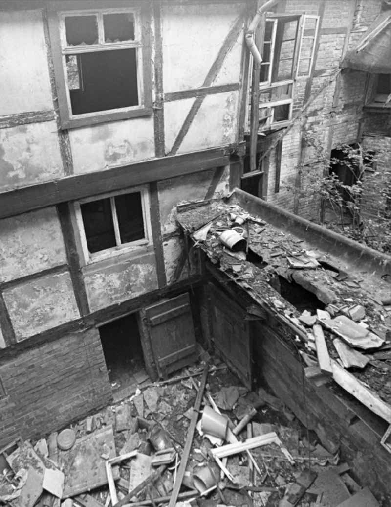 Rubble and ruins Rest of the facade and roof structure of the half-timbered house an der Bakenstrasse in Halberstadt in the state Saxony-Anhalt on the territory of the former GDR, German Democratic Republic
