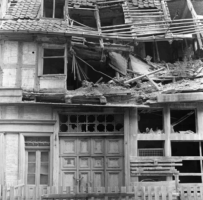 Rubble and ruins Rest of the facade and roof structure of the half-timbered house Dominikanerstrasse - Groeperstrasse in Halberstadt in the state Saxony-Anhalt on the territory of the former GDR, German Democratic Republic