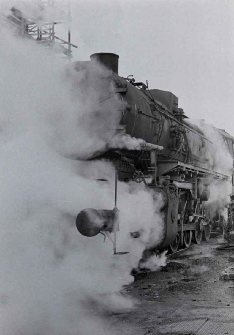 Maintenance and repair work on the operation of steam locomotives of the Deutsche Reichsbahn of the construction series 52 in Halberstadt in the state Saxony-Anhalt on the territory of the former GDR, German Democratic Republic