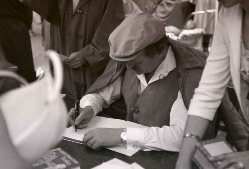 Writer and author Erwin Strittmatter when signing his books in Halberstadt in the state Saxony-Anhalt on the territory of the former GDR, German Democratic Republic