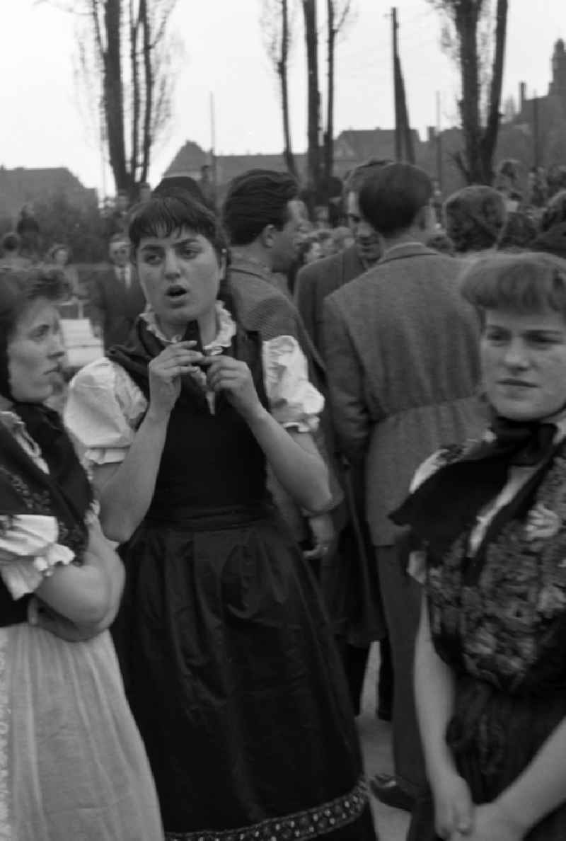 Members of a dance group of the folklore ensemble on a square on Harmoniestrasse in Halberstadt in the state Saxony-Anhalt on the territory of the former GDR, German Democratic Republic