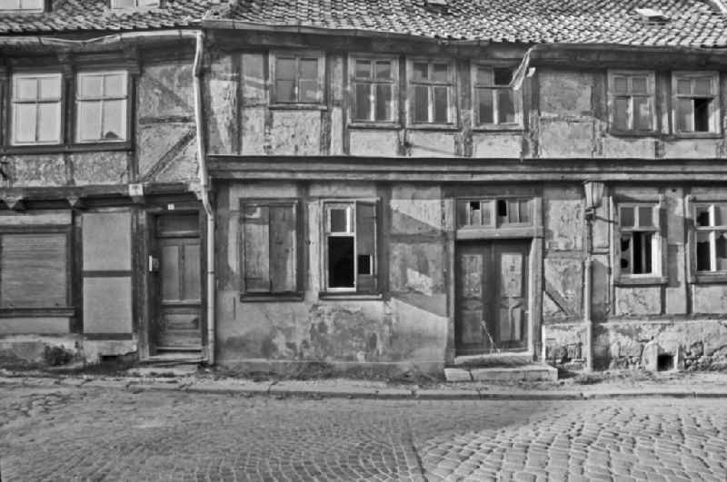 Rubble and ruins Rest of the facade and roof structure of the half-timbered house in Halberstadt, Saxony-Anhalt on the territory of the former GDR, German Democratic Republic