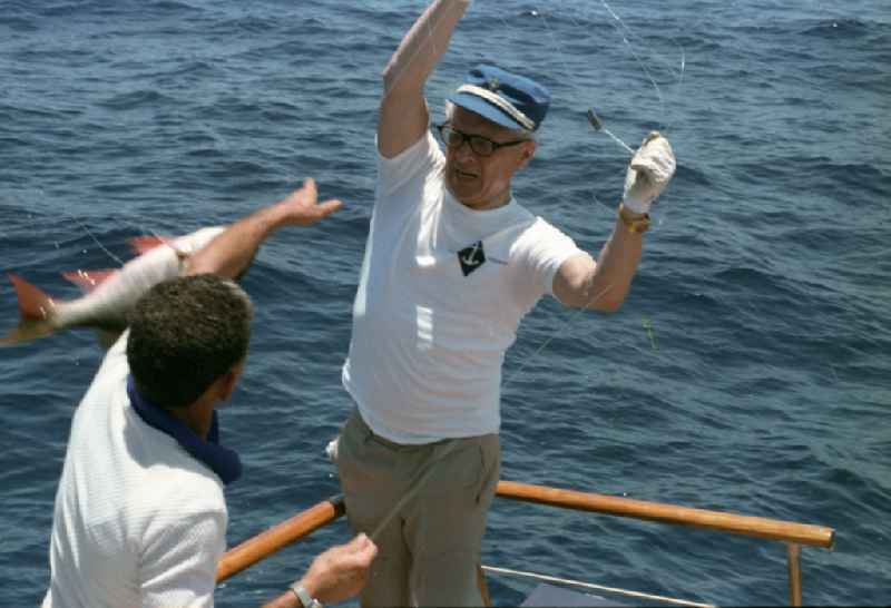 Enduring fishing by GDR State Council Chairman Erich Honecker and the Secretary of the Central Committee of the Communist Party of Cuba Fidel Alejandro Castro Ruz on a state yacht as part of the cultural context of an official state visit to Havana in Cuba