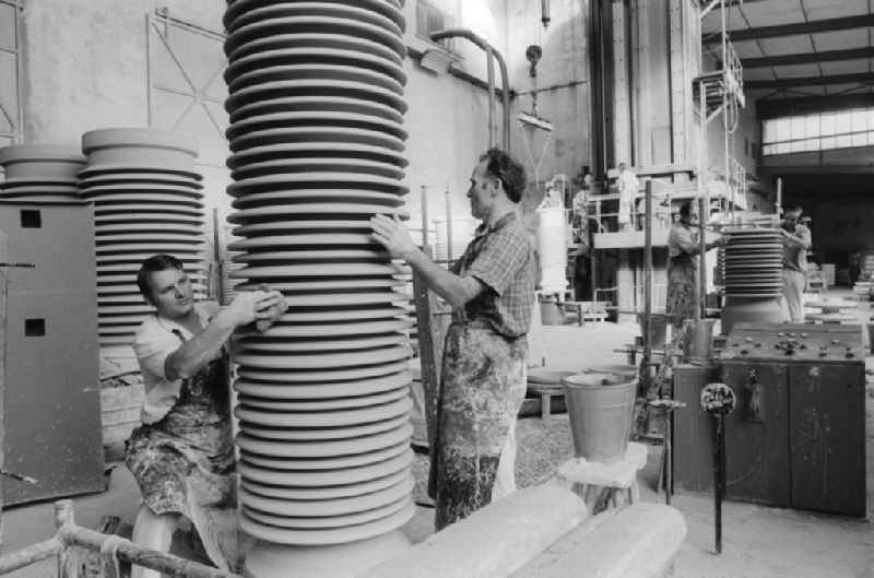 Employees of Ceramic Works Hermsdorf (KWH) in the production of high voltage insulators in Hermsdorf in Thuringia on the territory of the former GDR, German Democratic Republic