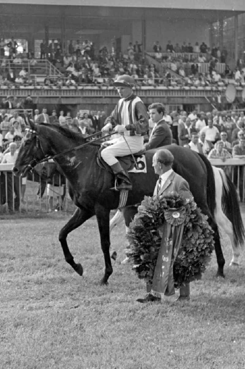 Main with Alexander Mirus after the derby win in Hoppegarten in the state Brandenburg on the territory of the former GDR, German Democratic Republic