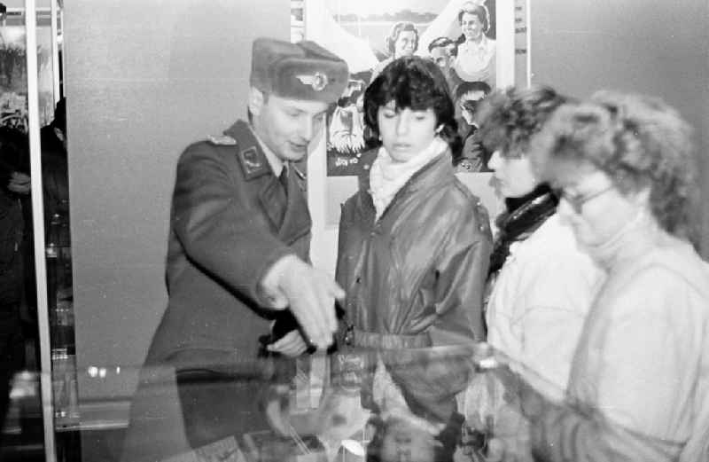 Captain Wilfried Eichmeyer during a tour of the Traditionszimmer exhibition with young visitors of the godparent school in the NVA - Office of the LSK Air Force - Air Defense of the Fliegertechnische Battalion 9 (FTB-9) in Karlshagen in the state of Mecklenburg-Western Pomerania on the territory of the former GDR, Germans Democratic Republic