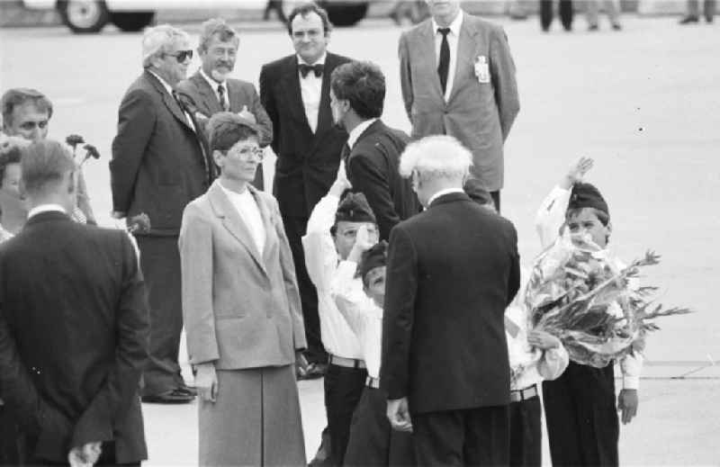 Welcome to Cologne-Bonn Airport. Selected citizens of the GDR, pioneers, children present flowers to Erich Honecker and make the pioneer greeting. SED General Secretary and Chairman of the State Council Erich Honecker arrives for the first visit of a leading GDR representative to the Federal Republic