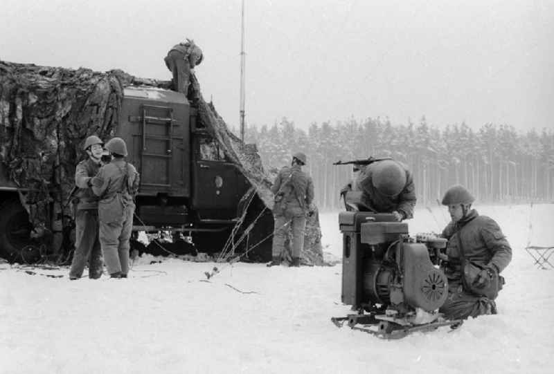 Soldiers of the 2nd news regiment of the NVA during a manoeuvre in winter in Wernsdorf in Koenigs Wusterhausen in the federal state Brandenburg in the area of the former GDR, German democratic republic