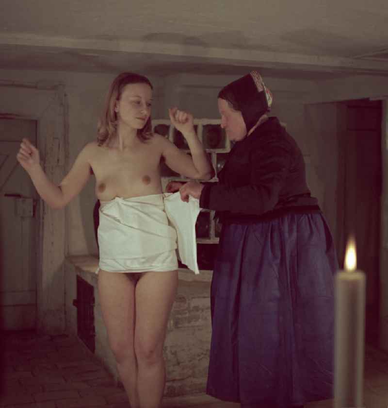 Traditional costumes and items of clothing - dressing ceremony for a young naked woman on the occasion of a Sorbian wedding in the district of Lehde in Luebbenau/Spreewald, Brandenburg in the territory of the former GDR, German Democratic Republic