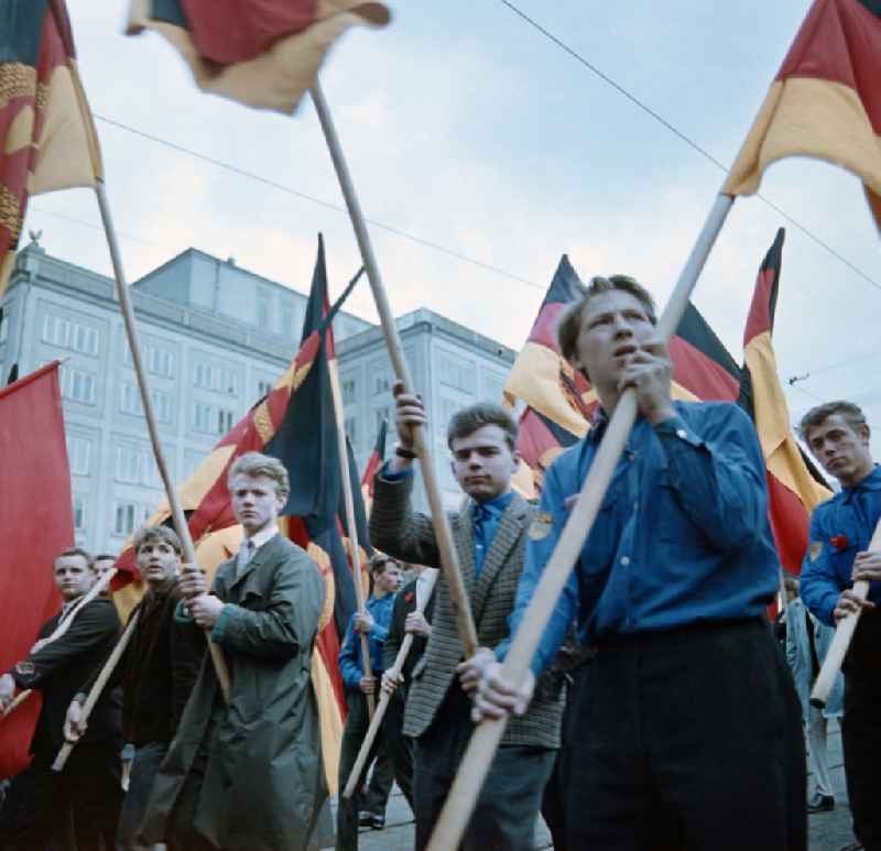 Parade with flags during the celebrations of the 1st of May 1964 in the district Mitte in Leipzig in the state Saxony on the territory of the former GDR, German Democratic Republic
