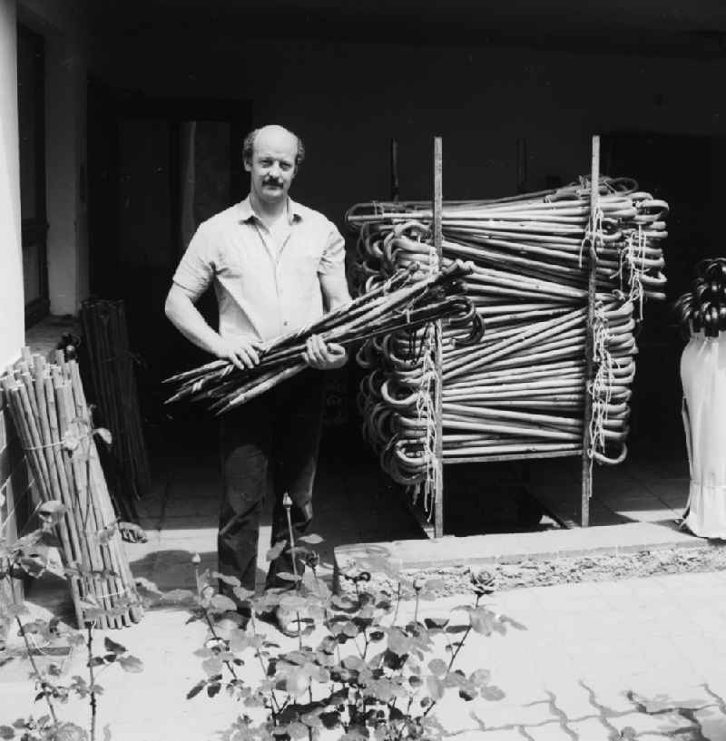 A floor-maker in front of his workshop in Lindewerra in the federal state of Thuringia on the territory of the former GDR, German Democratic Republic