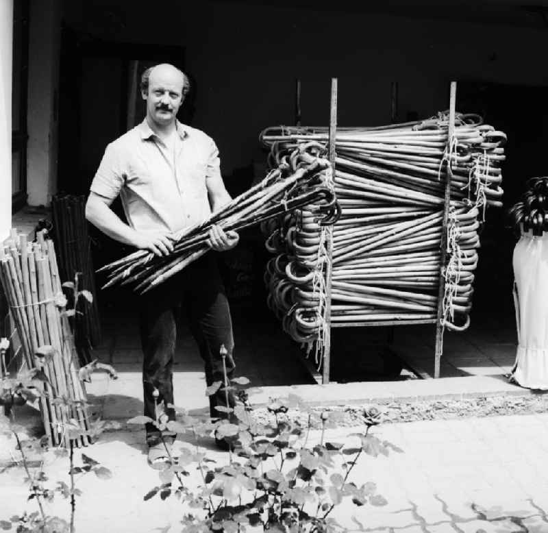 A floor-maker in front of his workshop in Lindewerra in the federal state of Thuringia on the territory of the former GDR, German Democratic Republic