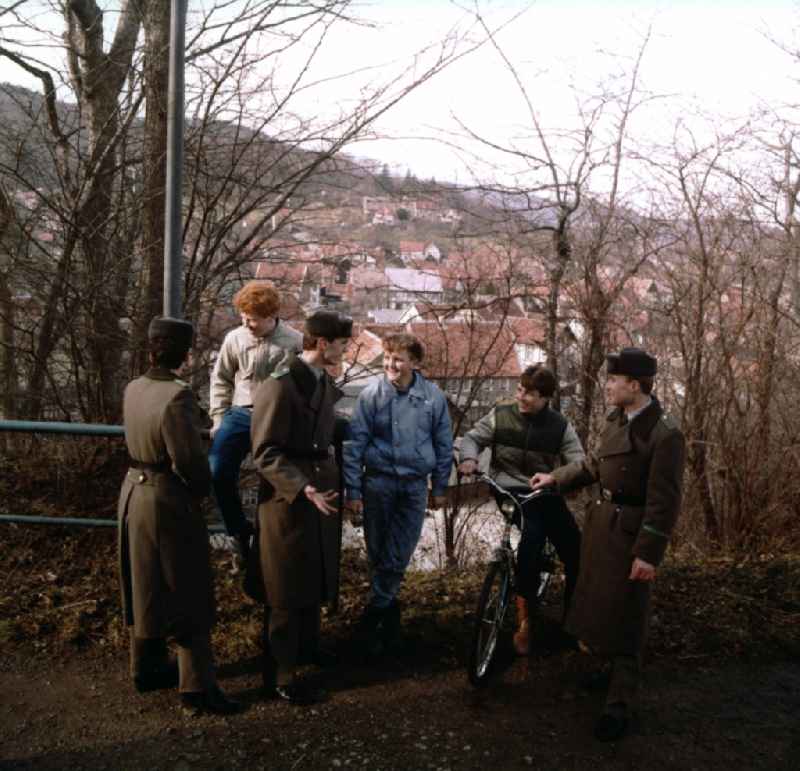 Located in the source uniform border guards of the GDR border troops in conversations with young people in Lindewerra - Wahlshausen in present-day state of Saxony-Anhalt