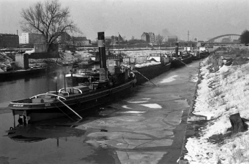 Barges on the River Elbe with ice floes in Magdeburg