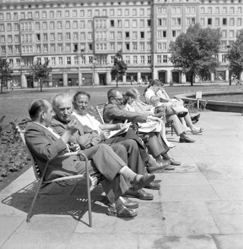 Pensioners sitting on a park bench in the center of Magdeburg in Saxony - Anhalt