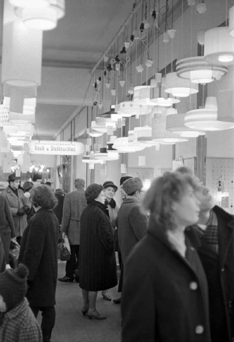 Customers in the department store in the lighting department in Magdeburg