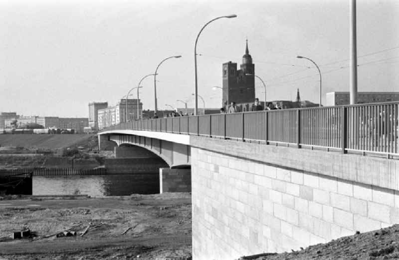 The new river bridge over the river Elbe in Magdeburg connects downtown with the district Werder on the Red Horn peninsula. It was inaugurated in 1965. In the background is the St. John's church