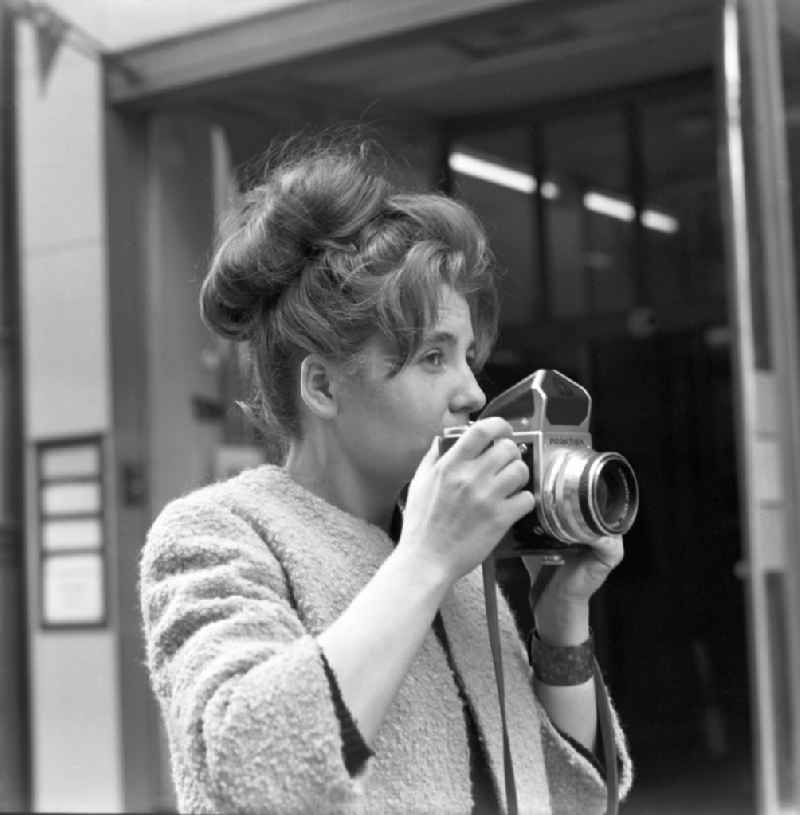 A woman in the photograph with a Praktisix in Magdeburg in Saxony - Anhalt. The Praktisix was introduced at Photokina 1956 and produced in its first version from 1957 to 1964