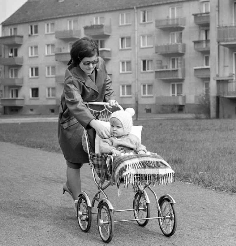 Young mother with baby carriage in Magdeburg