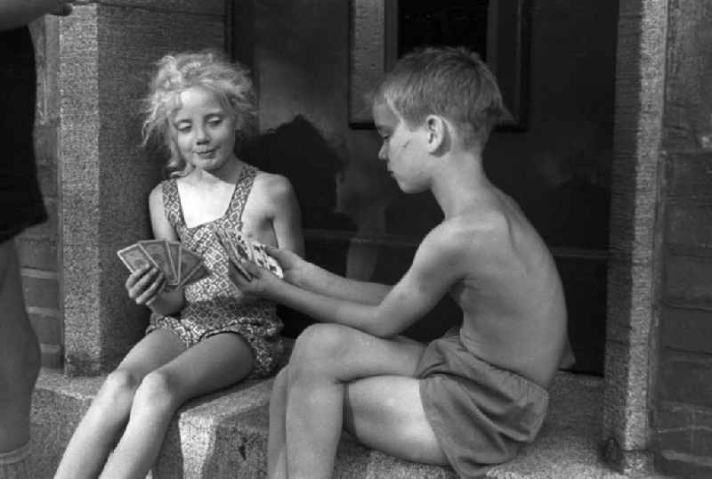 Children at play cards in Malge in Brandenburg