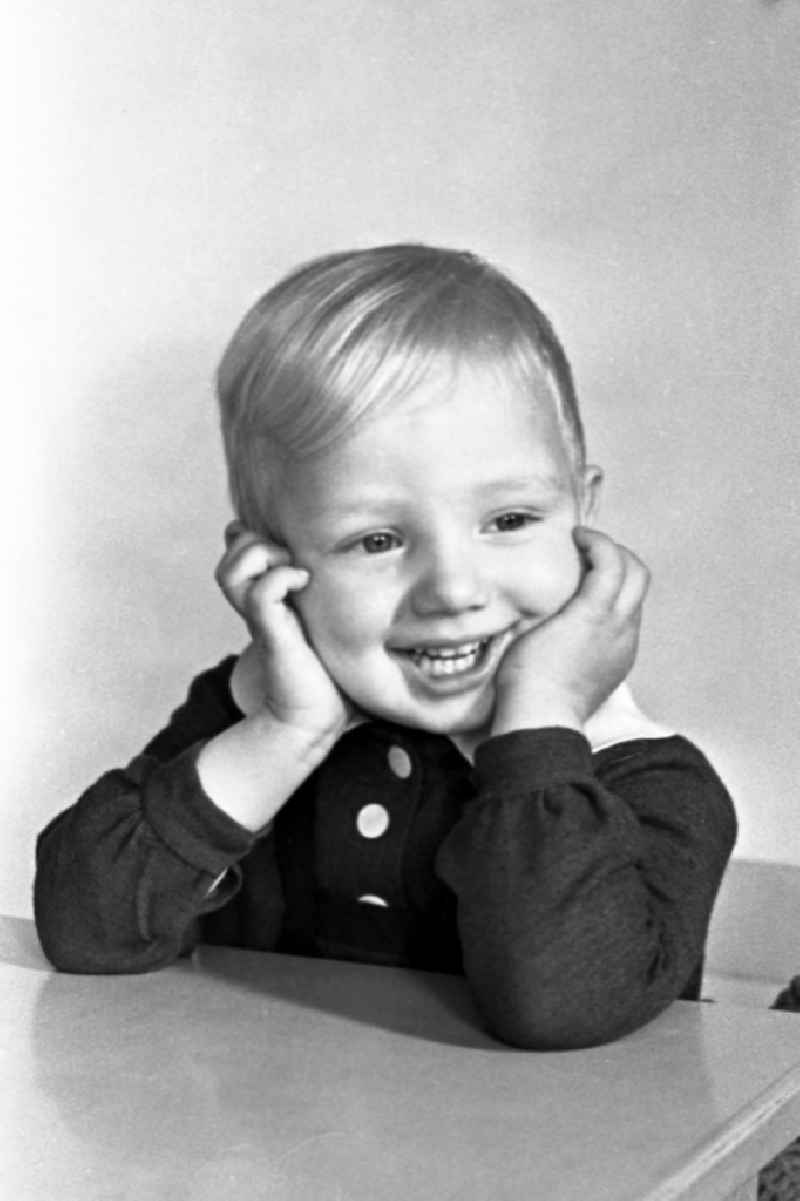 A small boy in the portrait in Merseburg in the federal state Saxony-Anhalt in the area of the former GDR, German democratic republic