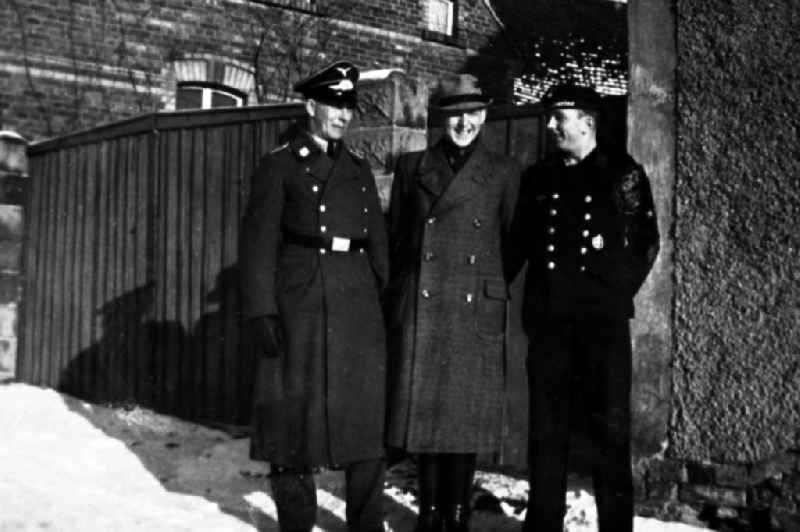 Three men in uniforms in Merseburg in the federal state Saxony-Anhalt in Germany