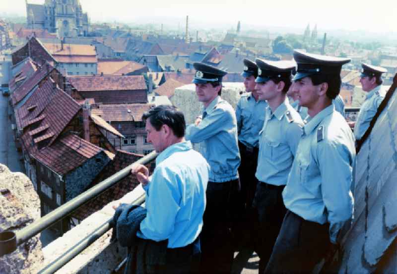 City tour and tour young NVA soldiers - land forces in downtown Mühlhausen in Thuringia