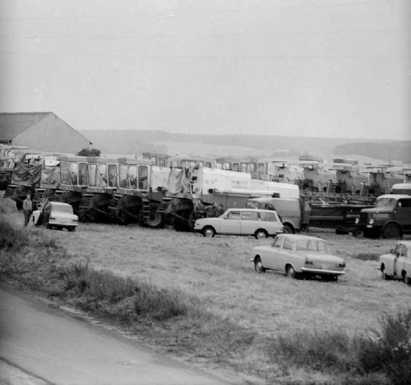 Combine harvesters arm for the journey in the south districts of the republic to the harvest of grain in Michendorf in the federal state Brandenburg in the area of the former GDR, German democratic republic
