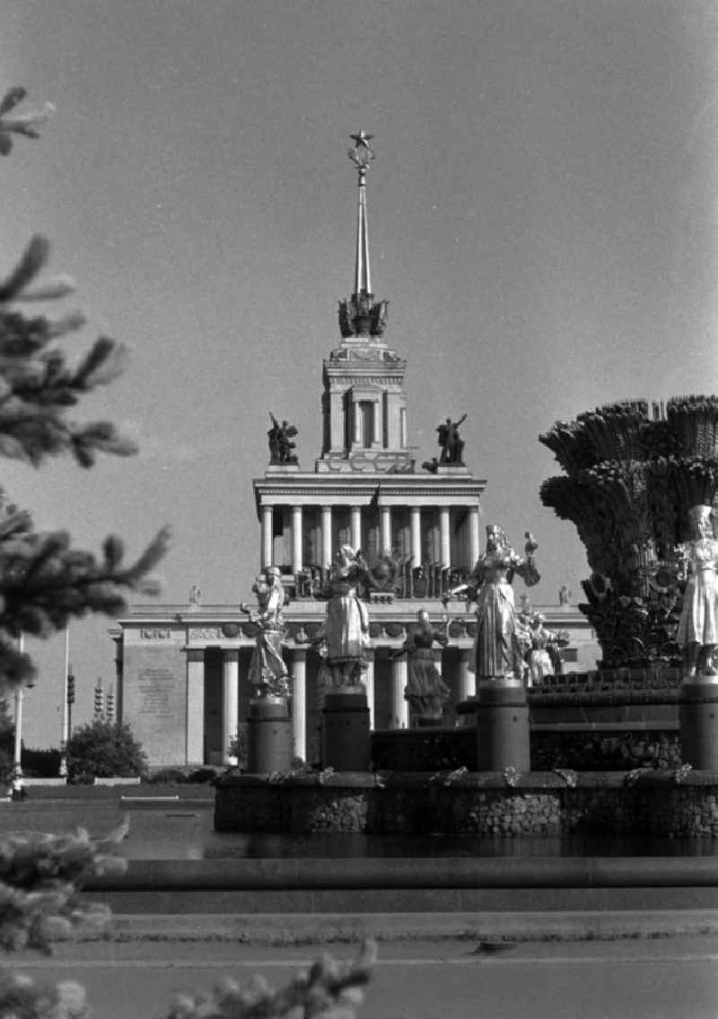 The exhibition of achievements of national economy of the USSR (VDNKh) in Moscow. It was intended as a show of the achievements of socialism and was in the Soviet Union as a showpiece that demonstrated the power of the Soviet planned economy. In the foreground stands the Fountain of International Friendship. Behind the central pavilion