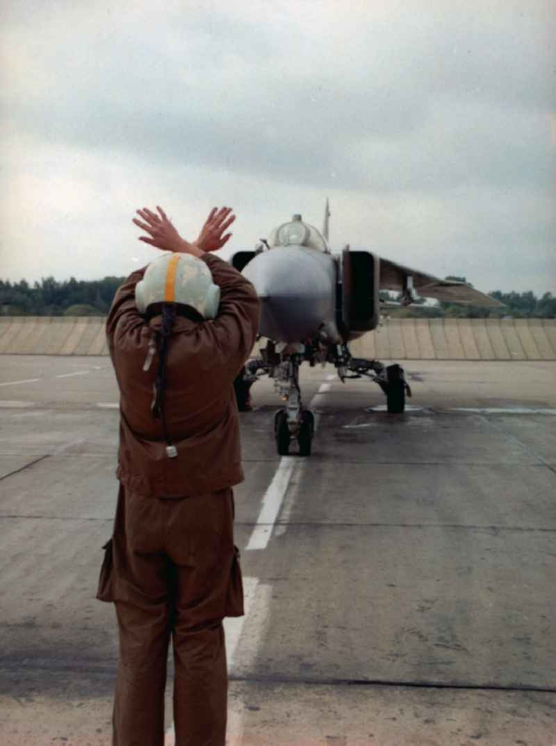 Parking of a fighter of the LSK / LV of the NVA of the GDR type Mig-23 on the apron of the airfield Peenemünde in today's state of Mecklenburg-Vorpommern