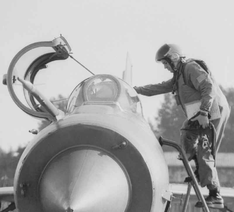 Fighter pilot Major Heinz Kast when entering the cockpit of a MIG-21 fighter squadron of 9 in Peenemuende in Mecklenburg-Western Pomerania in the field of the former GDR, German Democratic Republic