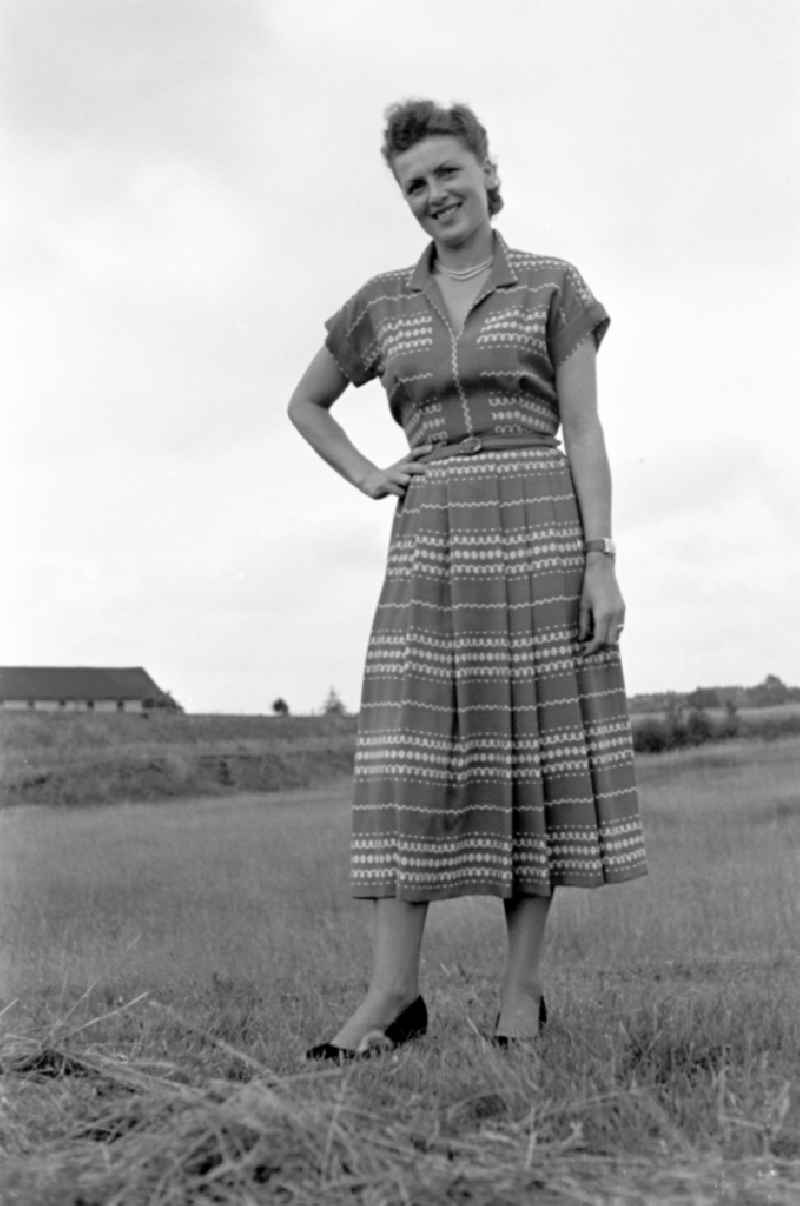 Young woman presents current women's fashion collection des VEB Plauener Damen-Konfektion in Plauen Vogtland in the state Saxony on the territory of the former GDR, German Democratic Republic