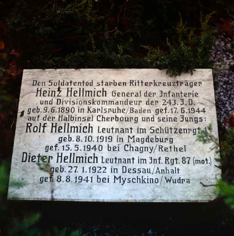 Inscription of a military-historical tombstone General Heinz Hellmich and sohn Leutnant Rolf and Dieter Hellmich in the cemetery in the district Bornstedt in Potsdam in the state Brandenburg on the territory of the former GDR, German Democratic Republic